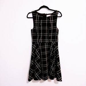 Elle fit and flare black checkered dress with high neckline, great for the offic